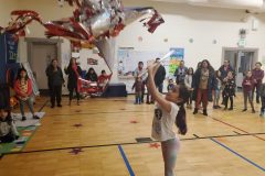 Piñata time - young girl reaching high