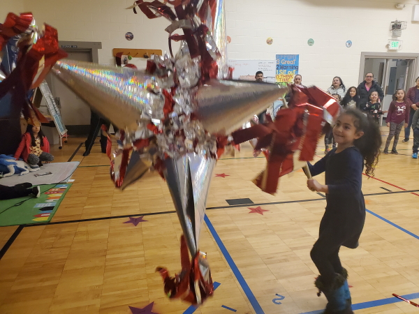 Girl hitting a pinata